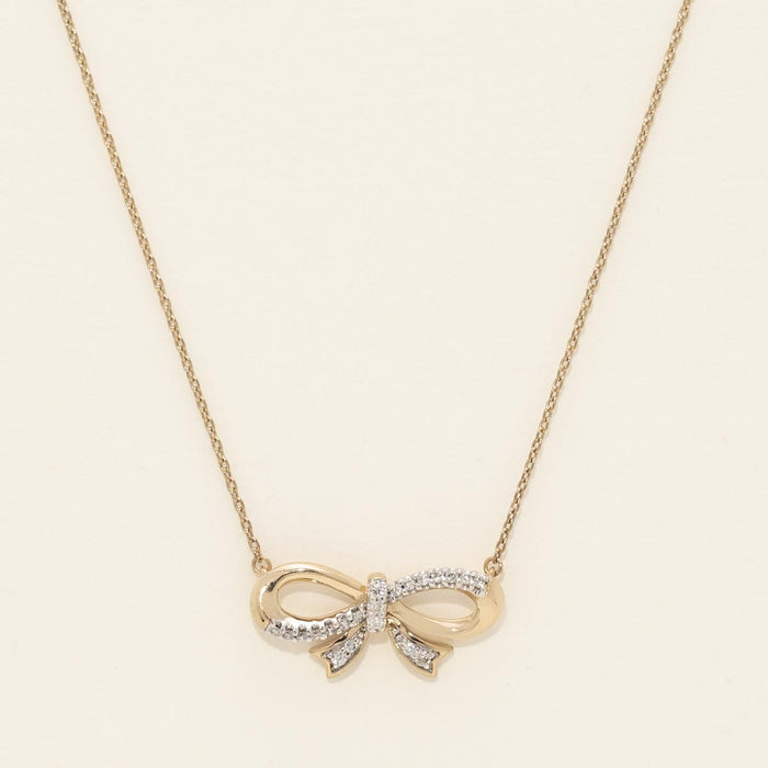 Diamond Bowtie Necklace in Sterling Silver with Yellow Gold Plating (1/10ct tw)