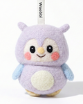 Front view of a handmade Woobbi owl keychain, crafted from soft lavender wool felt. The owl features large black eyes, rosy pink cheeks, a small yellow beak, and a cream-colored belly patch. It has light blue wings and is attached to a black metal keyring with a white tag labeled 'Woobbi'. The background is plain white with soft studio lighting.